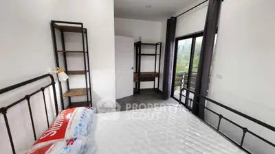 Modern bedroom with balcony access and minimalist design