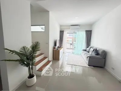Spacious modern living room with sleek design and natural light
