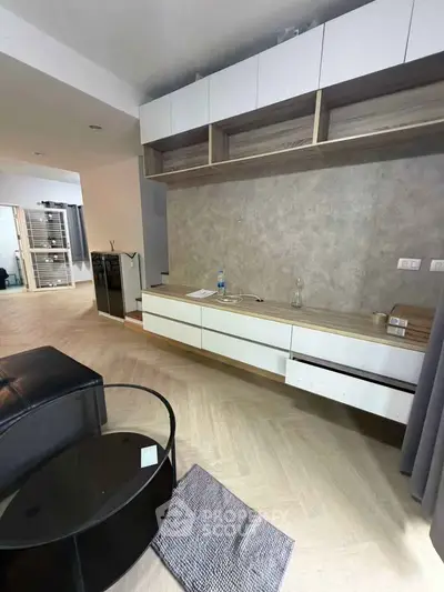 Modern living room with sleek storage and stylish decor