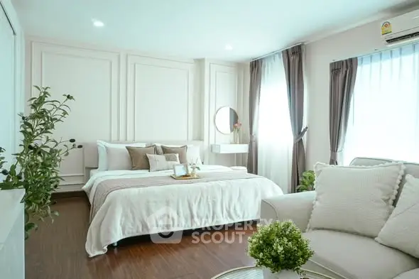 Luxurious bedroom with elegant decor and natural light