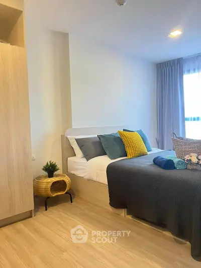 Modern bedroom with stylish decor and natural light