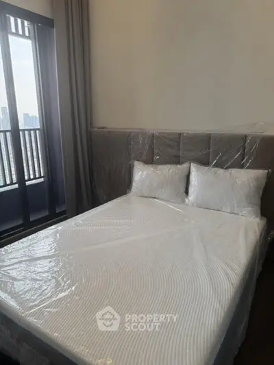 Modern bedroom with city view and elegant furnishings