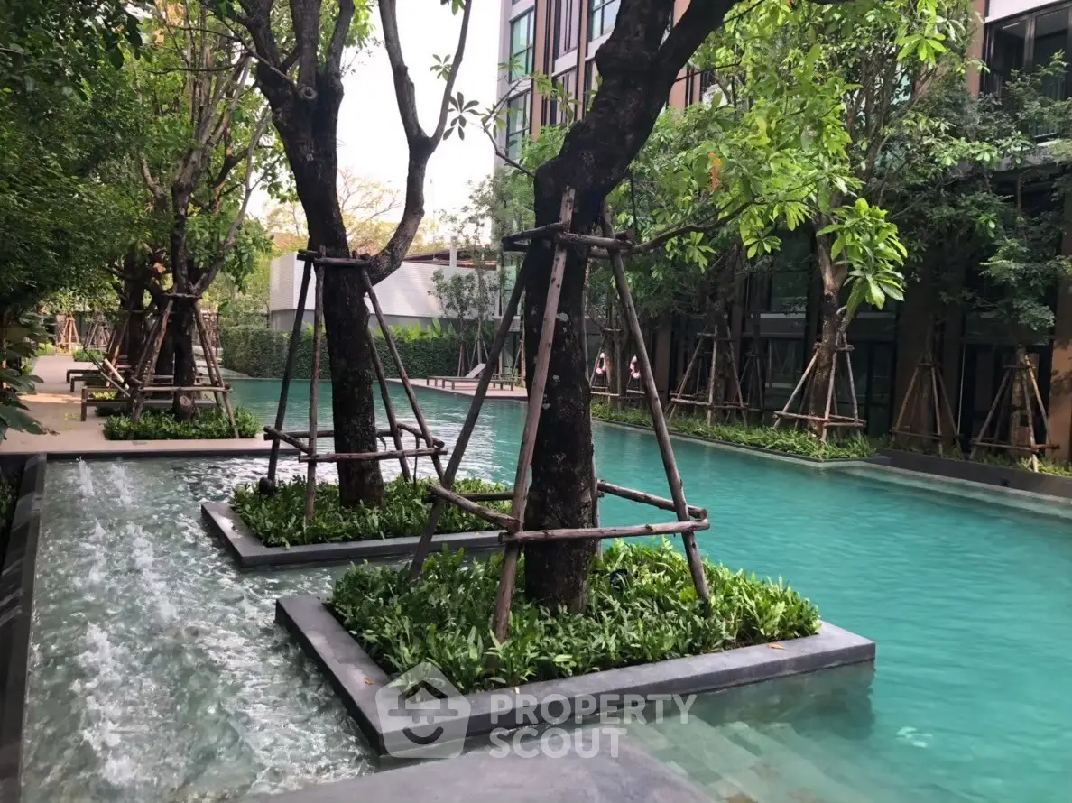 Luxurious residential pool with lush greenery and modern design