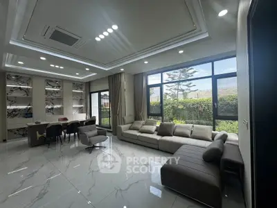 Luxurious modern living room with large windows and elegant marble flooring
