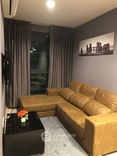 Cozy living room with brown sectional sofa and modern decor