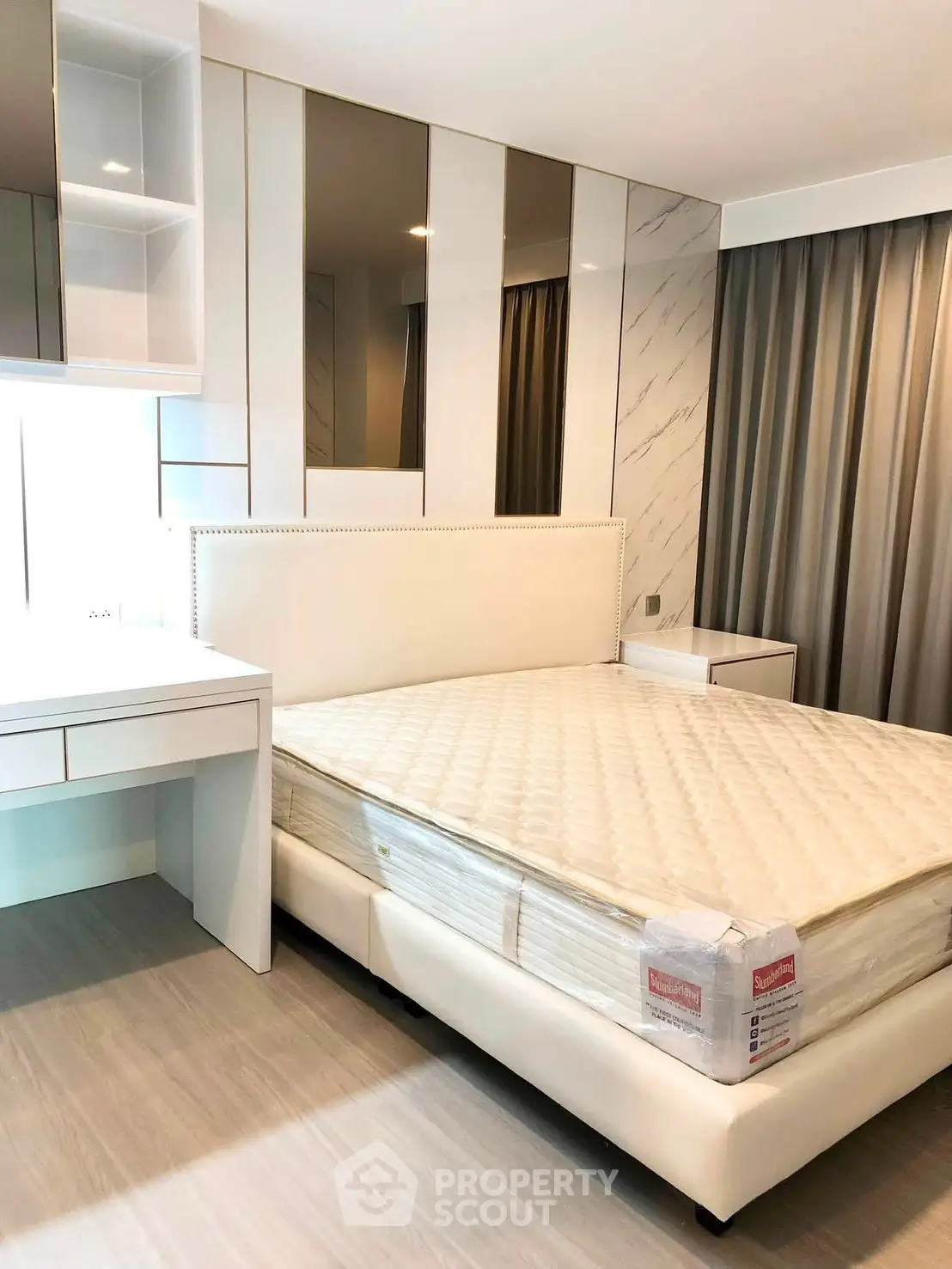Modern bedroom with stylish decor and comfortable bed in a contemporary apartment.
