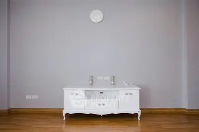 Minimalist living room with elegant white console and wooden flooring