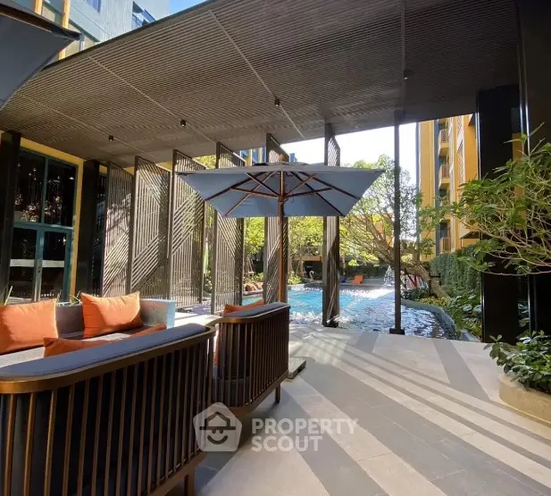 Luxurious poolside area with stylish seating and modern design elements.