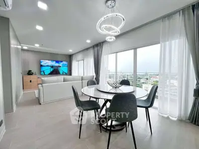 Modern living room with panoramic city view and elegant dining area