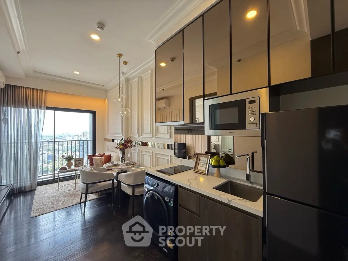 Luxurious open-plan living room and kitchen with city view balcony.