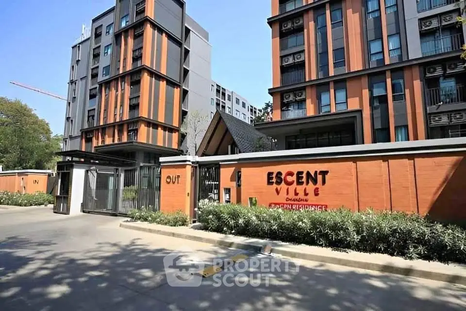 Modern residential building exterior with sleek design and lush landscaping at Escent Ville Chiangmai.