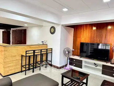 Modern living room with stylish bar counter and flat-screen TV