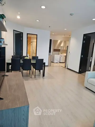 Spacious modern living room with dining area and open kitchen layout