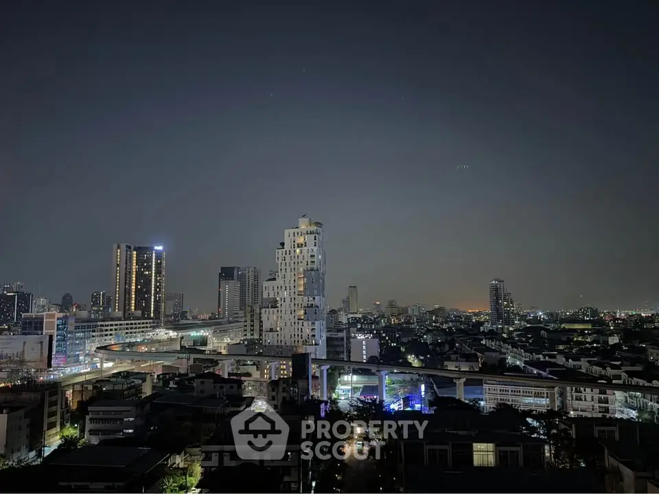 Stunning cityscape view of modern skyline at night with illuminated skyscrapers.