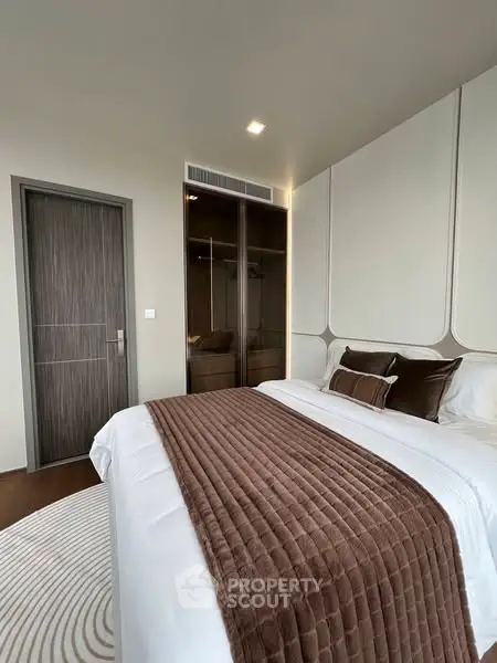 Luxurious modern bedroom with elegant decor and plush bedding