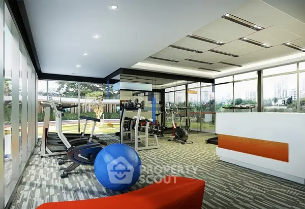 Modern gym with state-of-the-art equipment and large windows offering a scenic view.