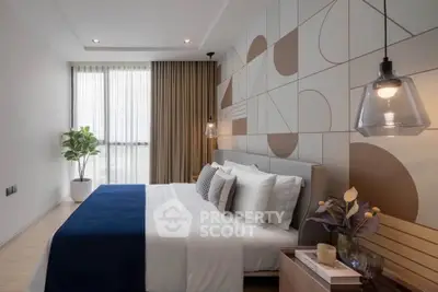 Modern bedroom with stylish geometric accent wall and cozy decor