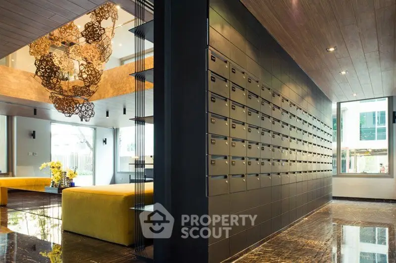 Luxurious apartment lobby with modern mailboxes and elegant decor