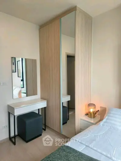 Modern bedroom with stylish wardrobe and cozy decor