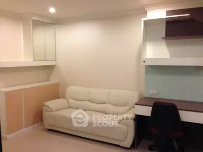 Modern living room with white sofa and built-in desk