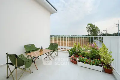 Spacious balcony with scenic view and cozy seating area, perfect for relaxation and outdoor enjoyment.