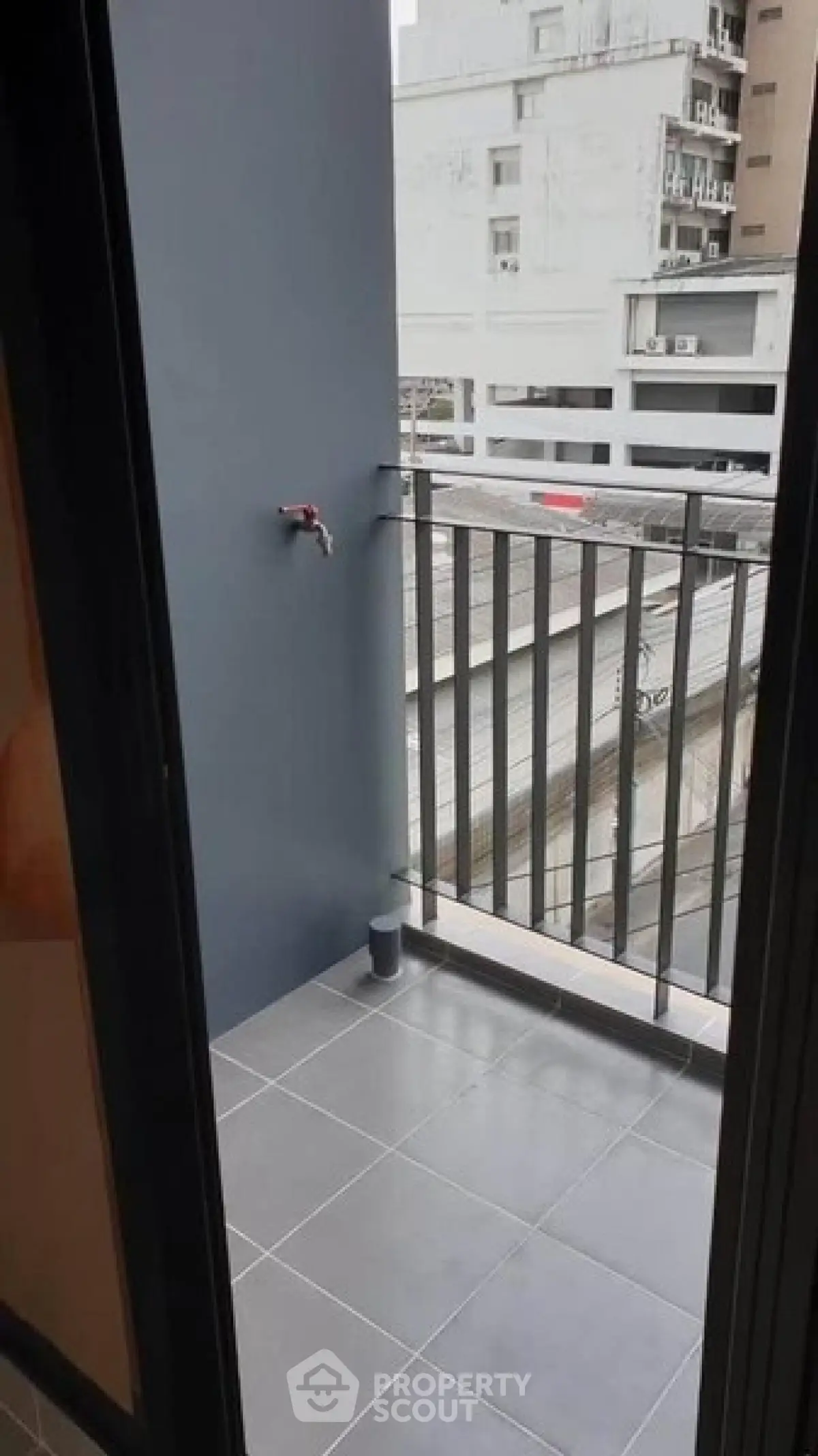 Modern balcony with sleek railing and urban view, perfect for city living.