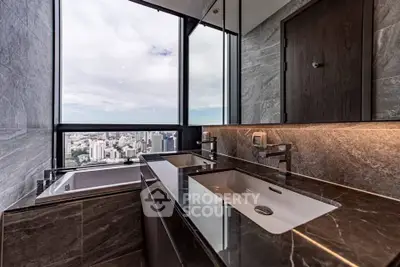 Luxurious bathroom with city view and modern fixtures