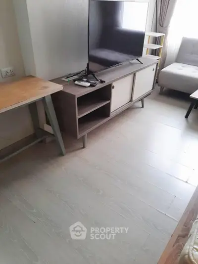 Modern living room with sleek TV stand and comfortable seating
