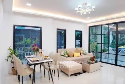 Modern living room with elegant dining area and large windows