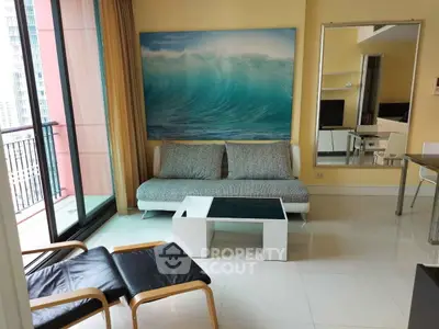 Modern living room with ocean wave artwork and balcony view