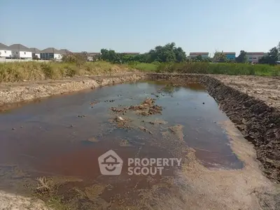 Expansive land with potential for development near residential area