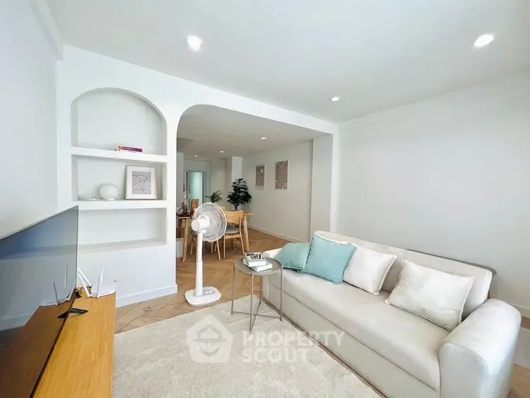 Bright living room with modern decor and cozy seating area