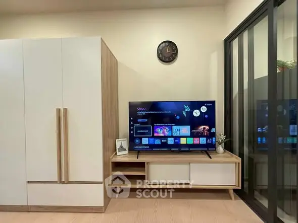 Modern living room with sleek TV setup and stylish storage solutions