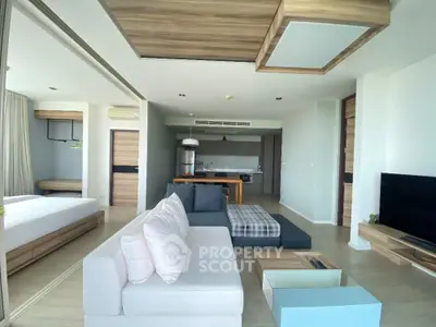 Spacious modern living room with open kitchen and stylish decor