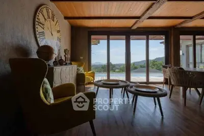 Stunning living room with panoramic views and stylish decor, featuring large windows and elegant furnishings.