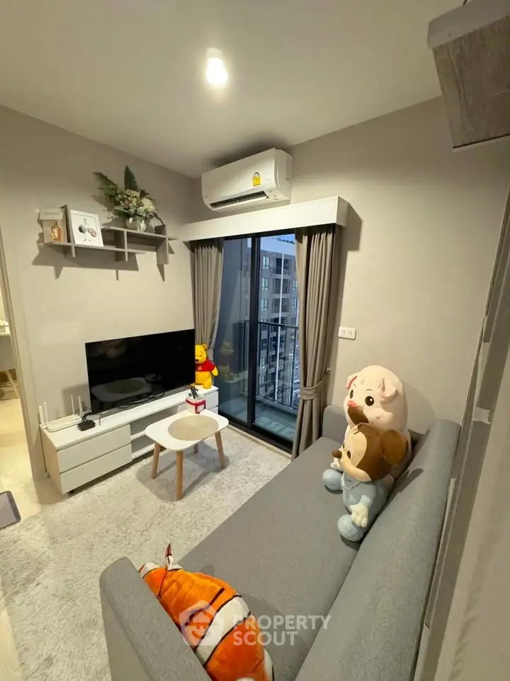 Modern living room with cozy decor and city view from large window