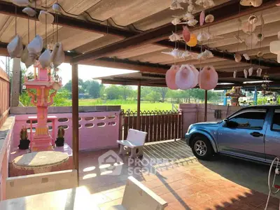 Charming carport with decorative elements and scenic countryside view