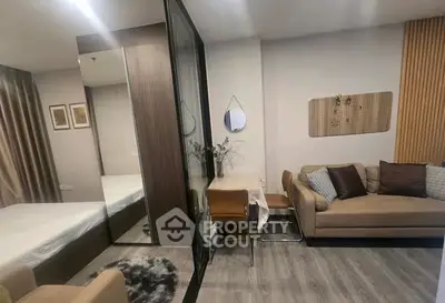 Modern studio apartment with cozy living area and stylish decor