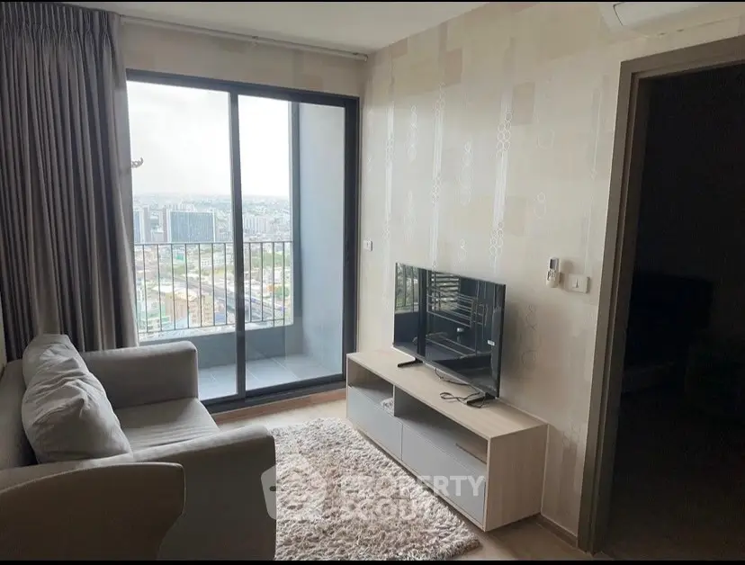 Modern living room with balcony view in high-rise apartment