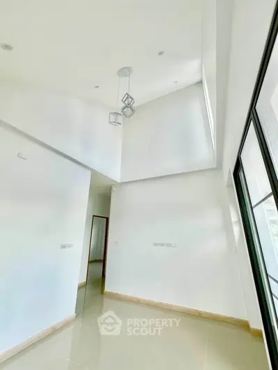 Spacious modern interior with high ceilings and large windows