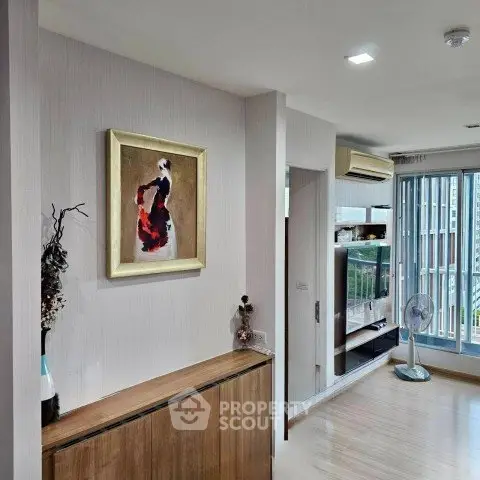 Modern living room with stylish decor and balcony access in a contemporary apartment.