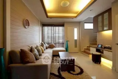 Modern living room with cozy sectional sofa and stylish lighting