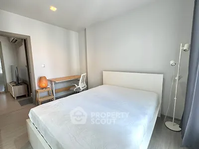 Modern bedroom with minimalist decor and natural light