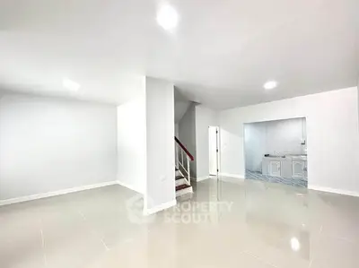 Spacious modern interior with sleek tile flooring and open layout