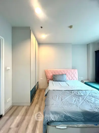 Modern bedroom with stylish bed and ample storage space