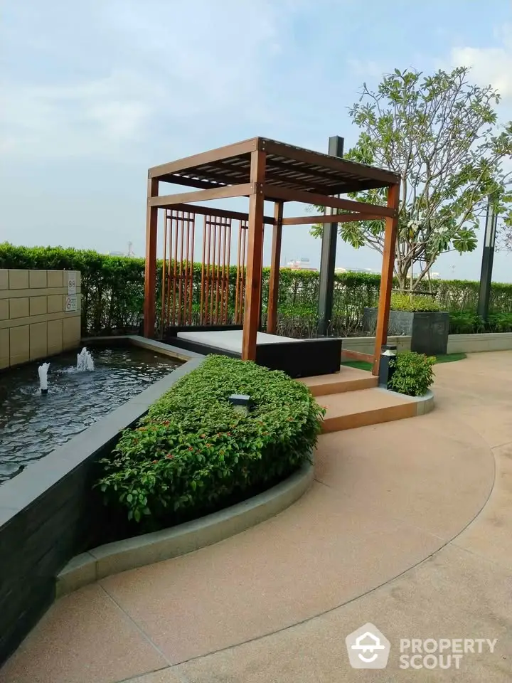 Luxurious rooftop garden with modern pergola and water feature