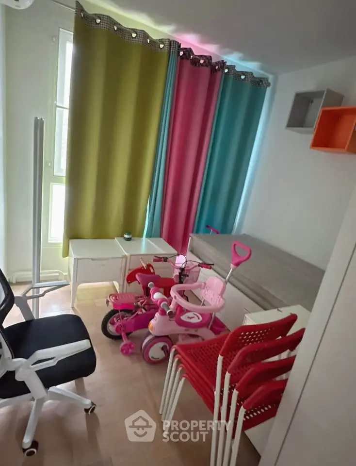 Charming children's room with colorful curtains and playful decor, perfect for a cozy family home.