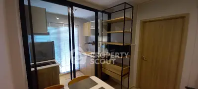 Modern kitchen with sleek design and ample storage in a cozy apartment