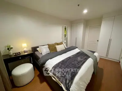 Cozy modern bedroom with stylish decor and ample storage space