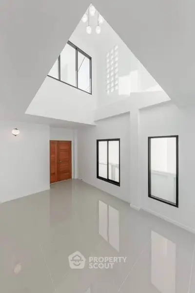 Spacious modern interior with high ceilings and large windows